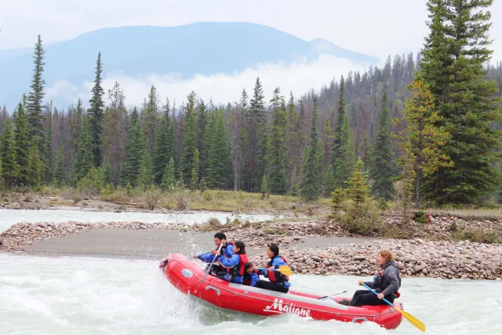 a group of people riding on the back of a boat